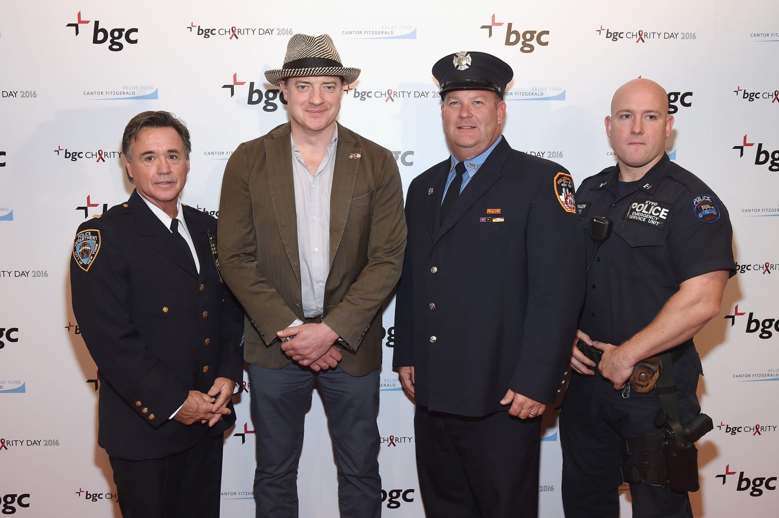 NEW YORK, NY - SEPTEMBER 12: Actor Brendan Fraser (2nd L) poses with New York's finest during Annual Charity Day hosted by Cantor Fitzgerald, BGC and GFI at BGC Partners, INC on September 12, 2016 in New York City. (Photo by Larry Busacca/Getty Images for Cantor Fitzgerald)