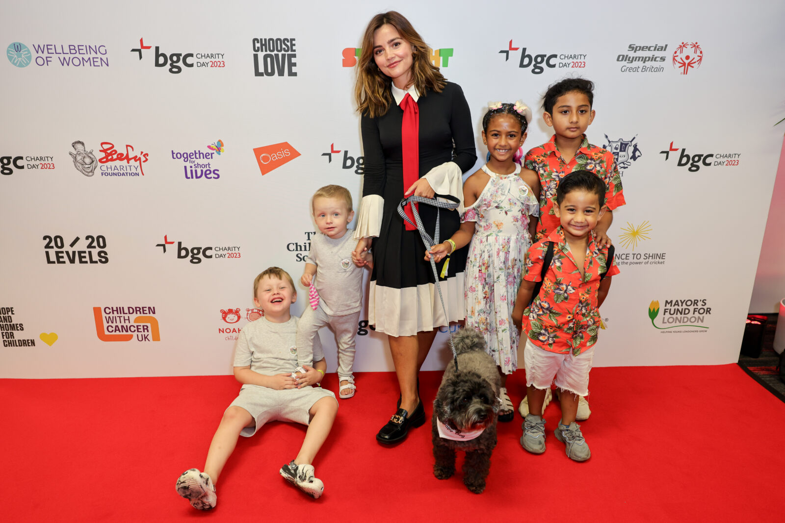 LONDON, ENGLAND - SEPTEMBER 11: Jenna Coleman (C) with charity guests attend the BGC Group Charity Day on behalf of Spread a Smile, raising millions for good causes in memory of BGC's colleagues lost on 9/11, on September 11, 2023 in London, England. Pic Credit: Dave Benett