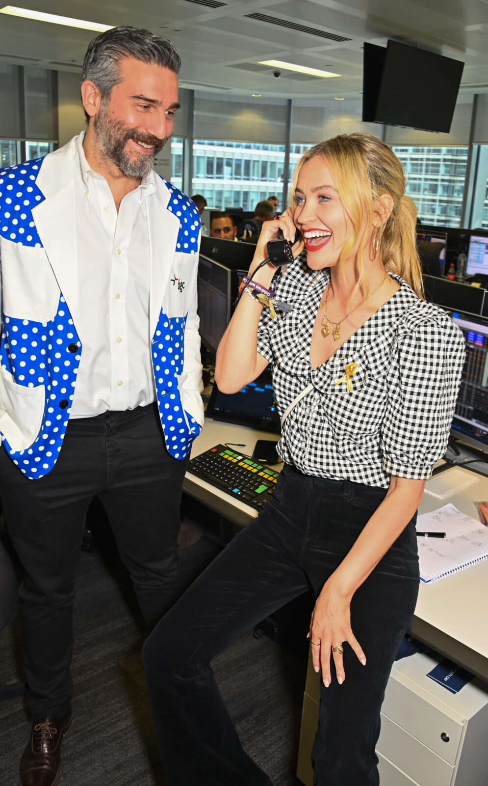 LONDON, ENGLAND - SEPTEMBER 11: Laura Whitmore (R) and a BGC trader attend the BGC Group Charity Day on behalf of Children with Cancer UK, raising millions for good causes in memory of BGC's colleagues lost on 9/11, on September 11, 2023 in London, England. Pic Credit: Dave Benett